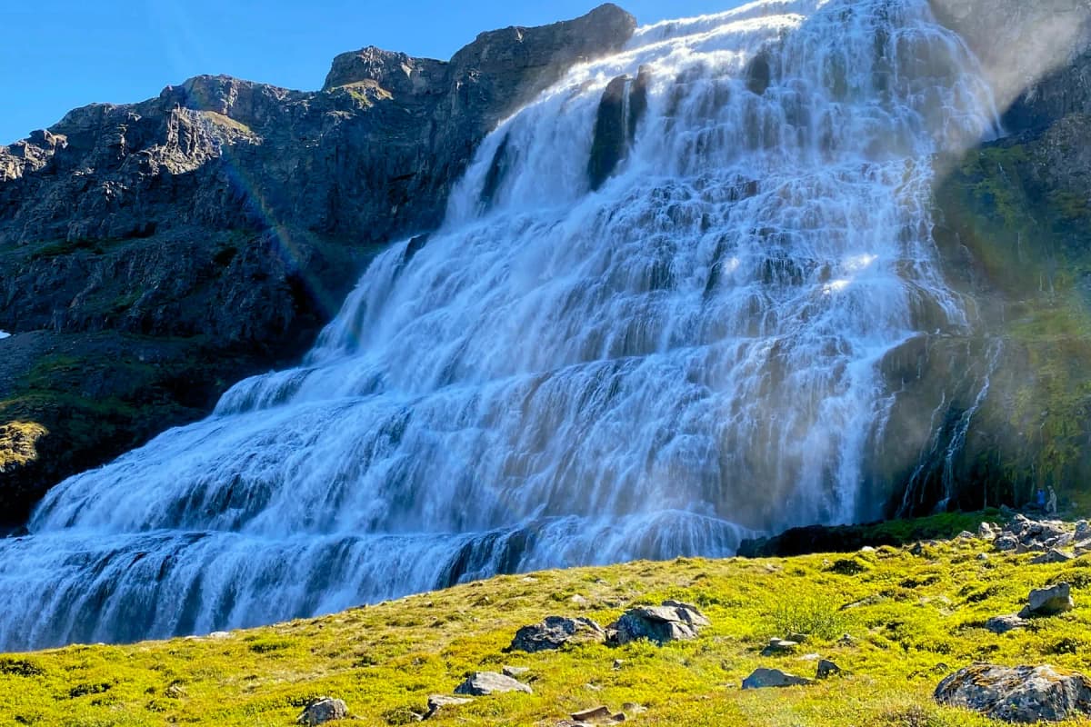 Best places to visit in Iceland: the wide, tiered Dynjandi waterfall cascading down a mountainside in the Westfjords