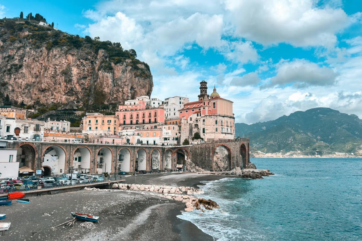 An empty beach at Atrani on the Amalfi Coast in winter with waves rolling in