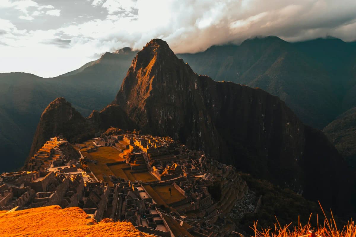 Early light on Machu Picchu, with Huayna Picchu rising behind the ruins