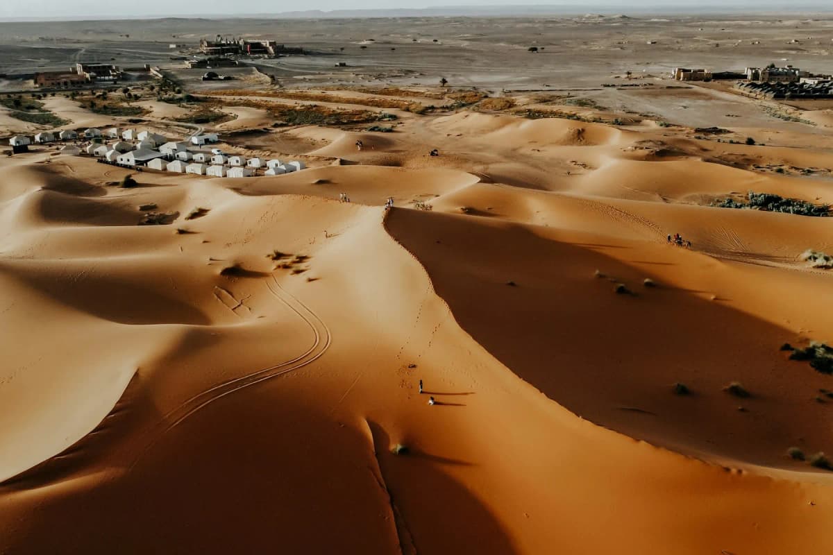 A tented desert camp among the Erg Chebbi sand dunes at Merzouga