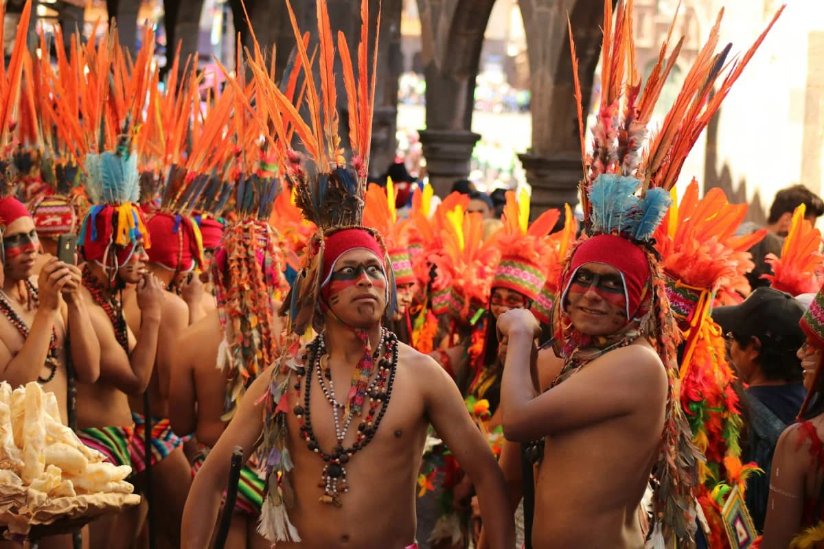 Dancers in feathered costumes during the Festival of the Sun in Cusco's main square