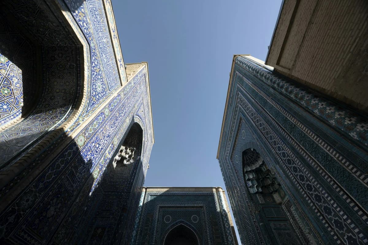 Looking up at the blue-tiled portals of the Shah-i-Zinda necropolis in Samarkand
