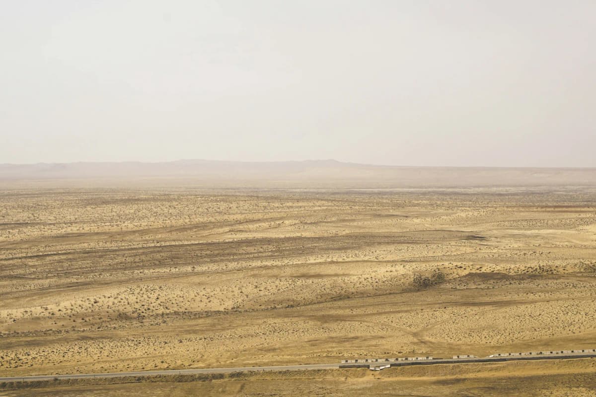 The flat, dusty Kyzylkum desert near Khiva, stretching to the horizon