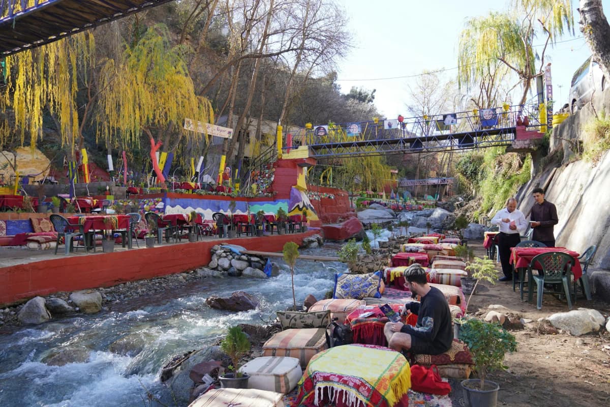 Colourful riverside café tables beside the stream in the Ourika Valley