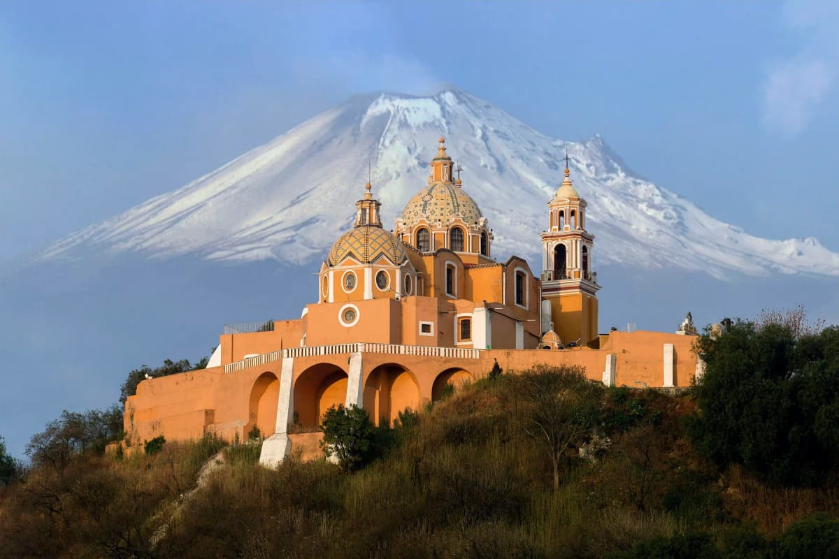 The Santuario de la Virgen de los Remedios on top of the Great Pyramid of Cholula, with Popocatépetl behind