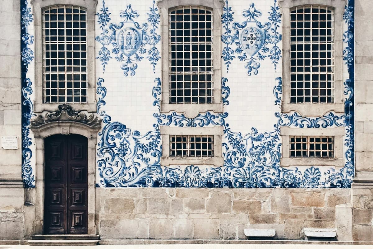 Blue and white azulejo tiles covering a church façade in Porto