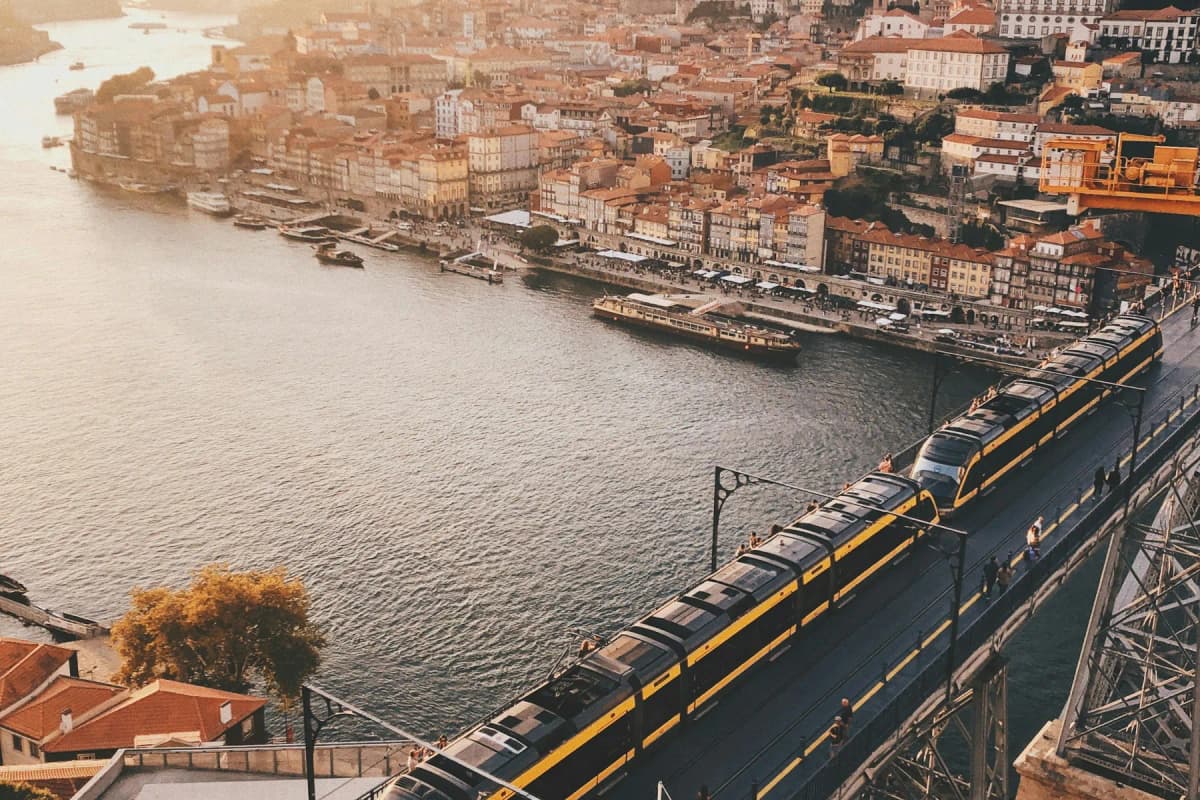 A Metro do Porto train crossing the upper deck of the Dom Luís I bridge above the Douro