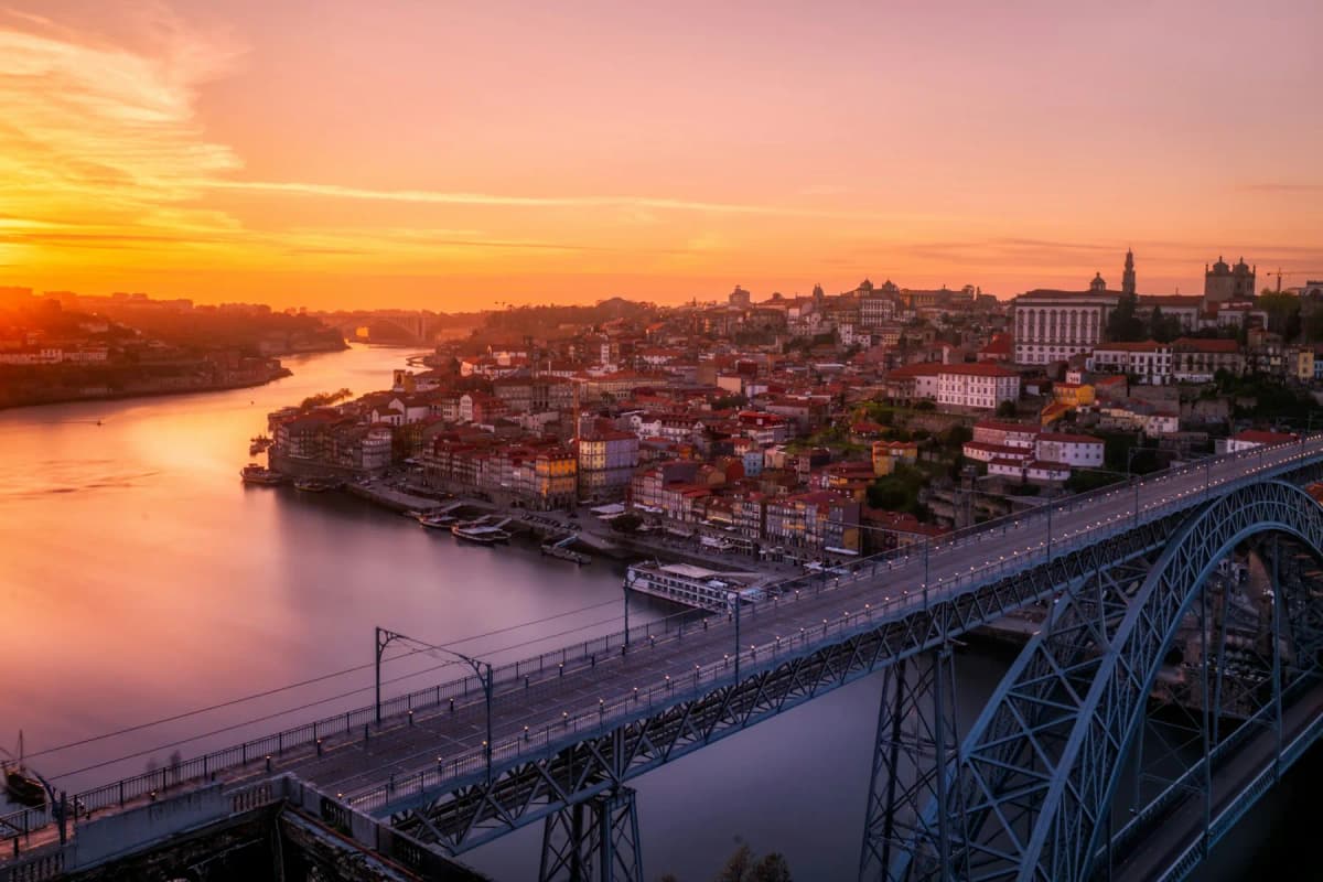 Sunset over the Douro river and the Dom Luís I bridge in Porto, seen from above