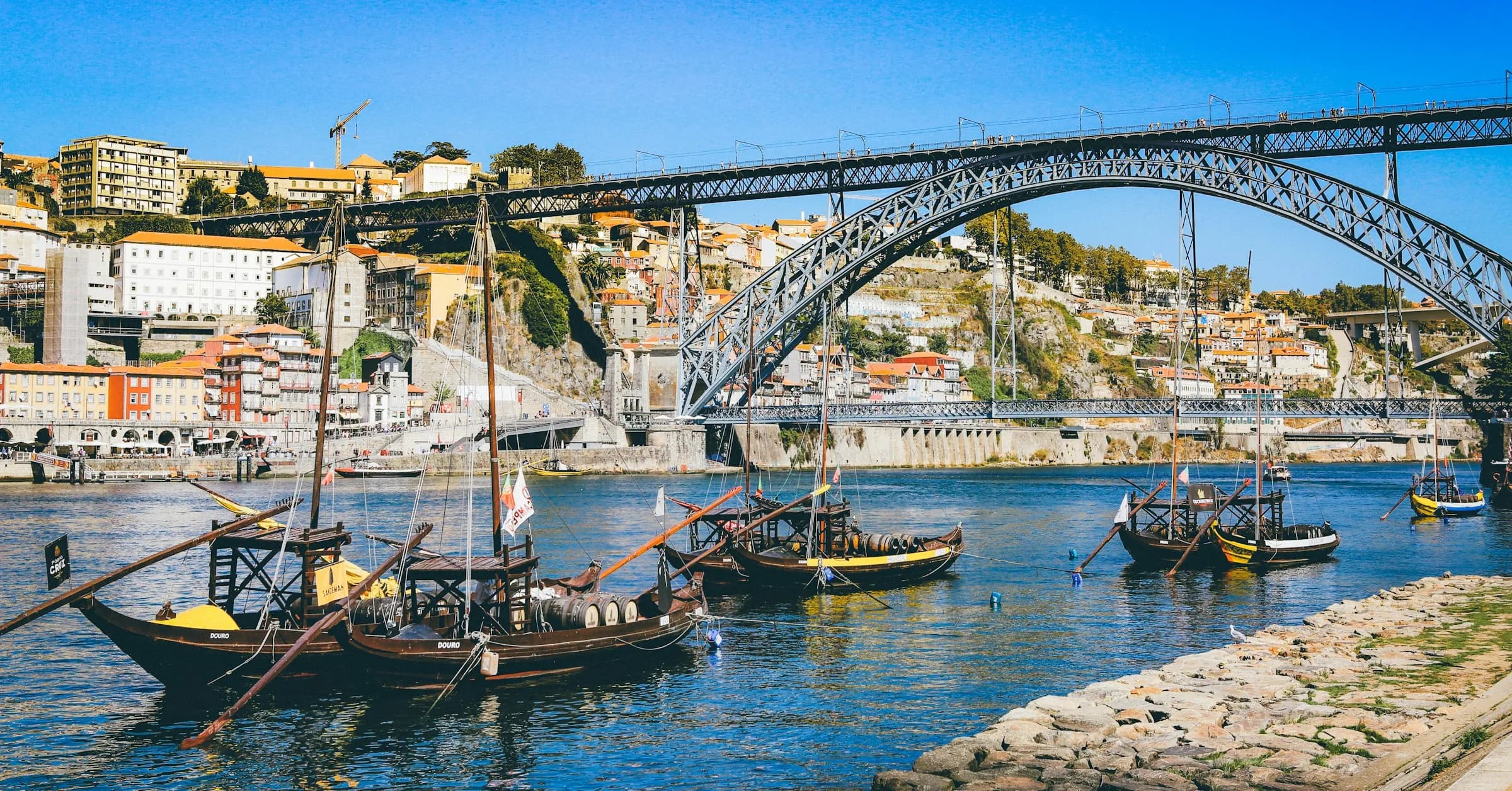 How many days in Porto: traditional rabelo boats moored on the Douro below the Dom Luís I bridge