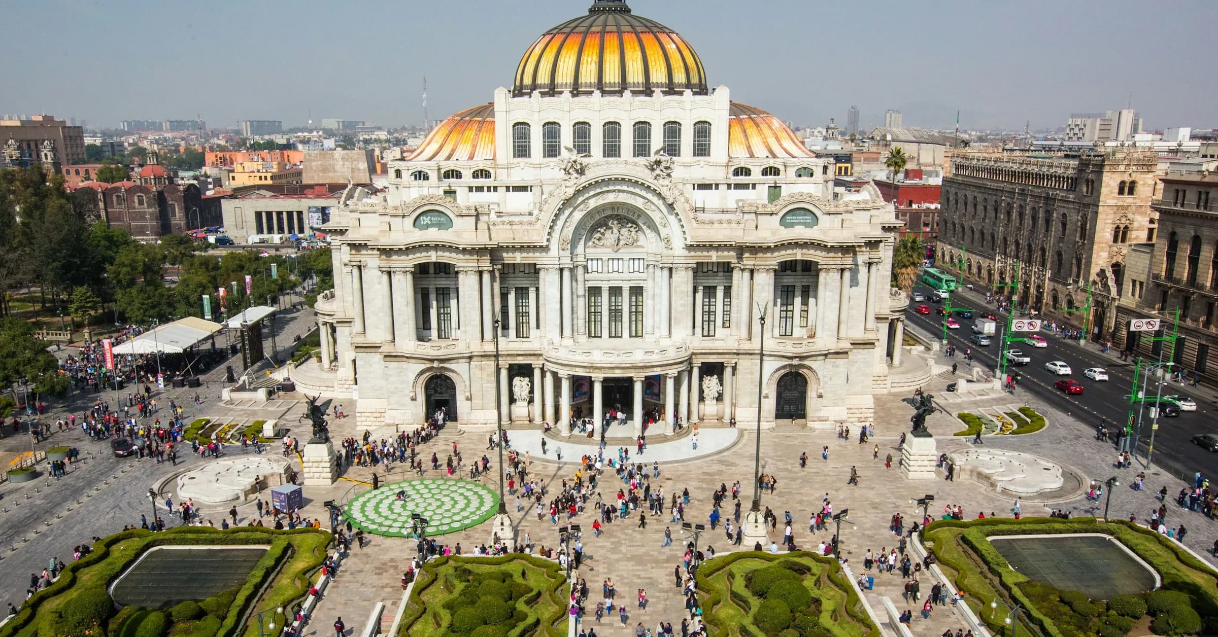 Mexico City itinerary: the Palacio de Bellas Artes with its orange and gold dome, seen from above