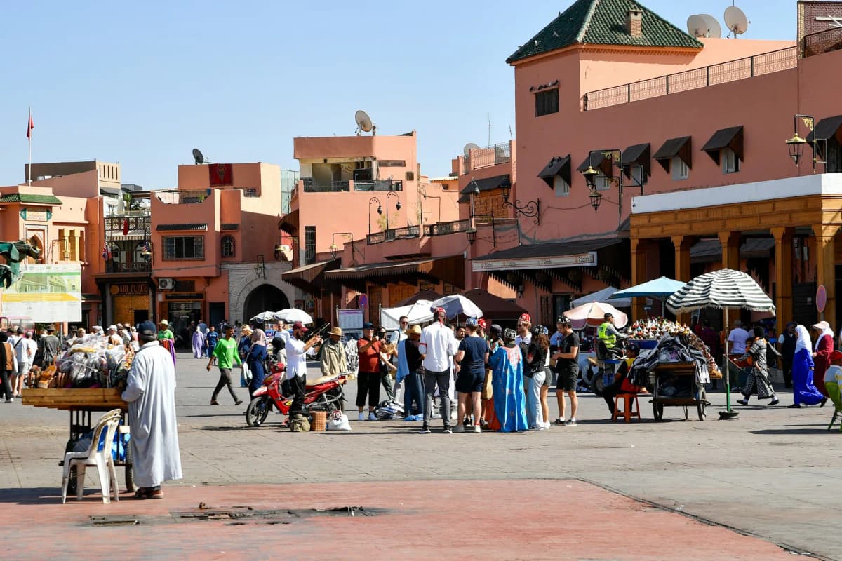 Morocco itinerary: Jemaa el-Fnaa square in Marrakech, with stalls and pink buildings around it