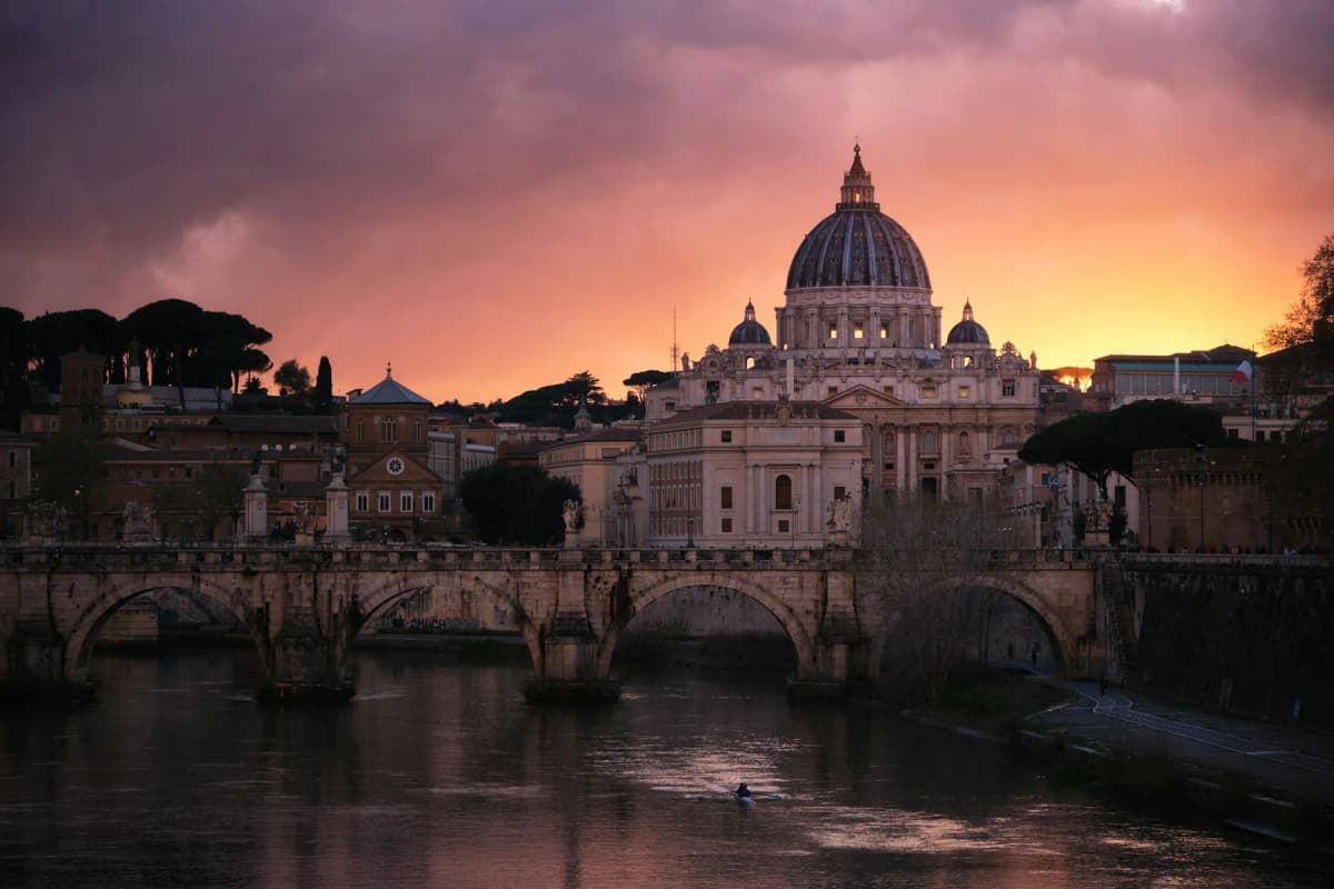 St Peter's Basilica and Ponte Sant'Angelo reflected in the Tiber at sunset
