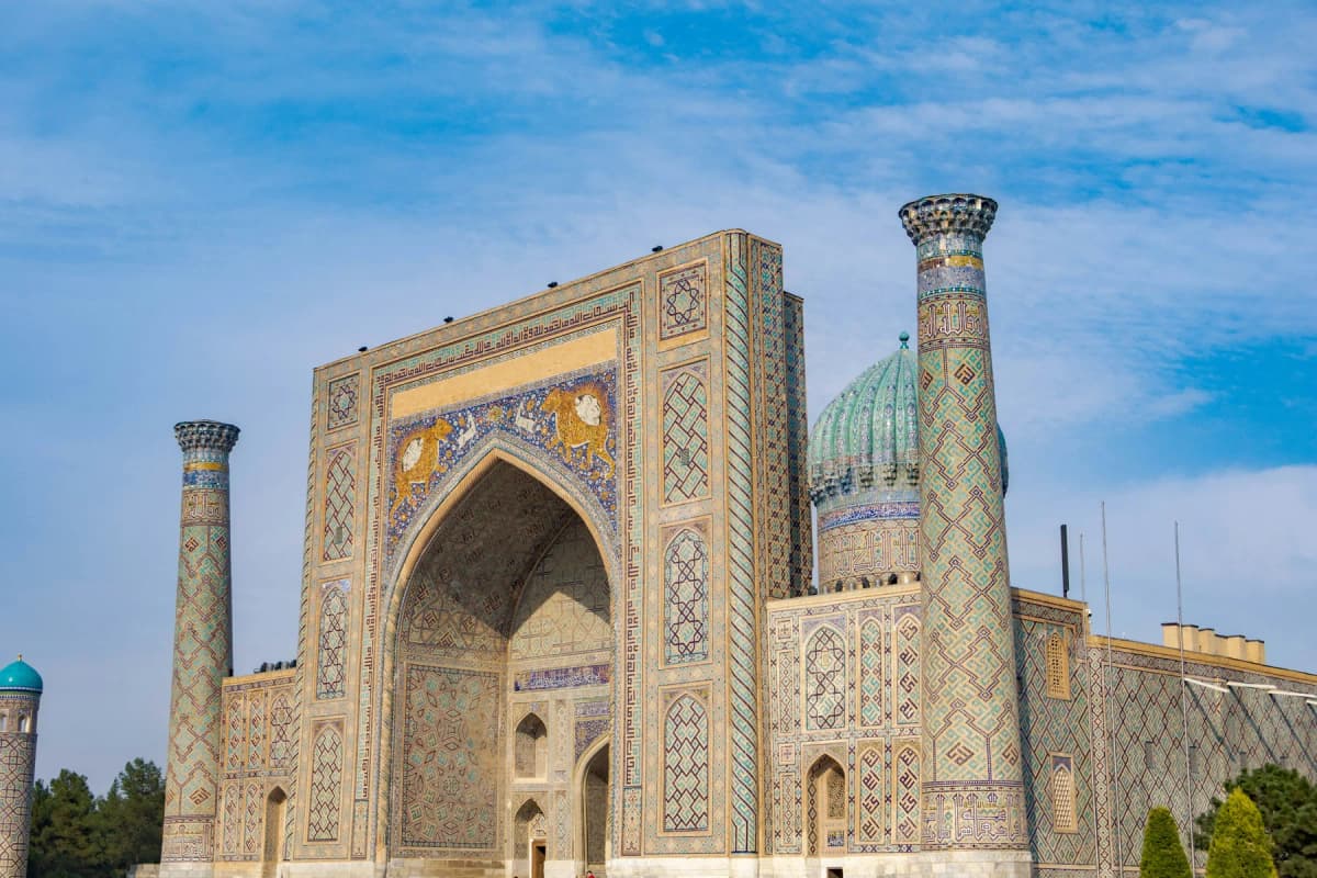 The tiled Sherdor Madrasah on Registan Square in Samarkand, early in the morning