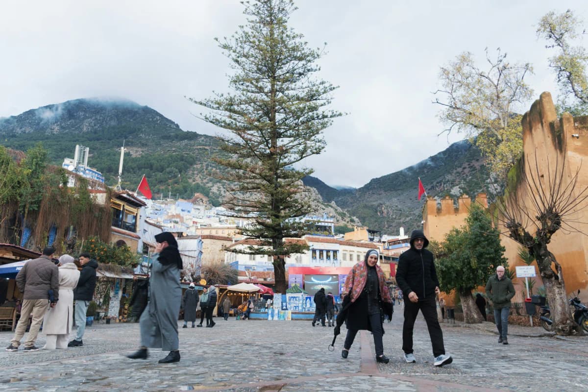 Plaza Uta el-Hammam in Chefchaouen with the red kasbah walls and café terraces