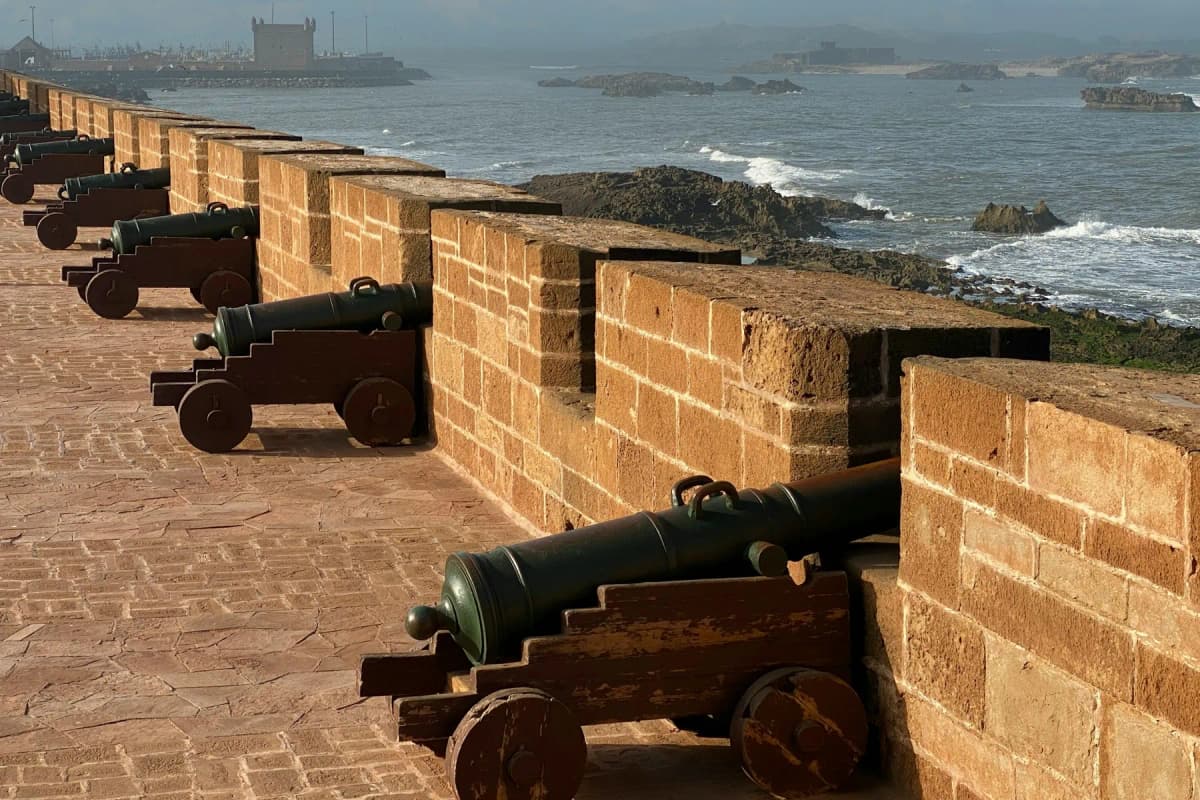 Things to do in Essaouira: bronze cannons lined up along the Skala de la Ville sea ramparts above the Atlantic