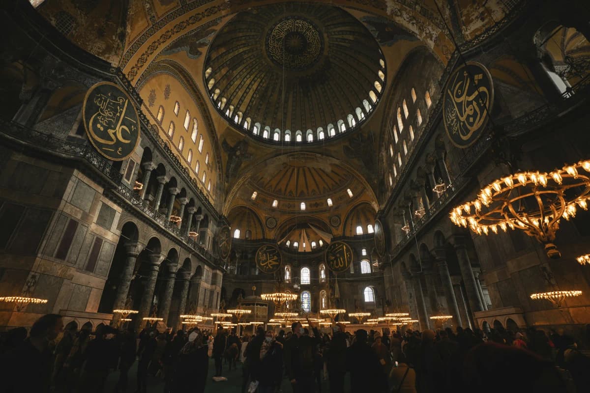 Things to do in Istanbul: the vast dome and Arabic calligraphy roundels inside Hagia Sophia
