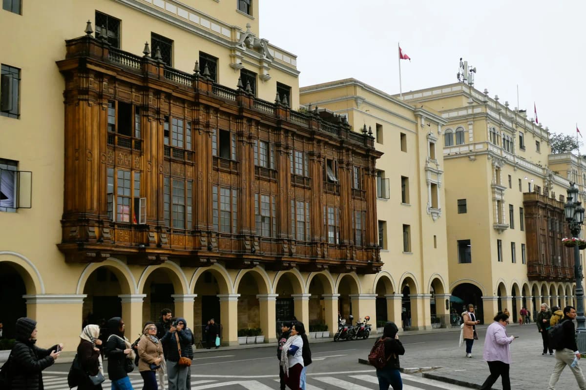 Carved wooden balconies on the yellow colonial buildings around Lima's Plaza Mayor