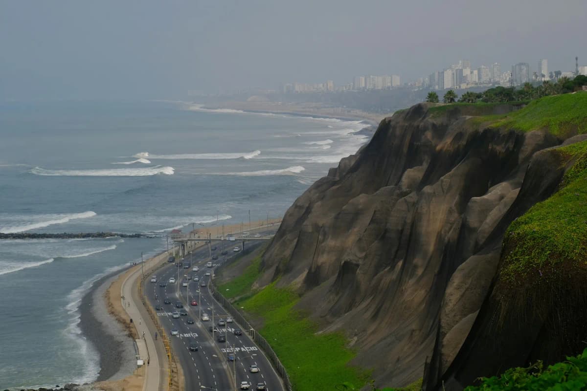 The Costa Verde highway and beaches below the green cliffs of Miraflores, Lima