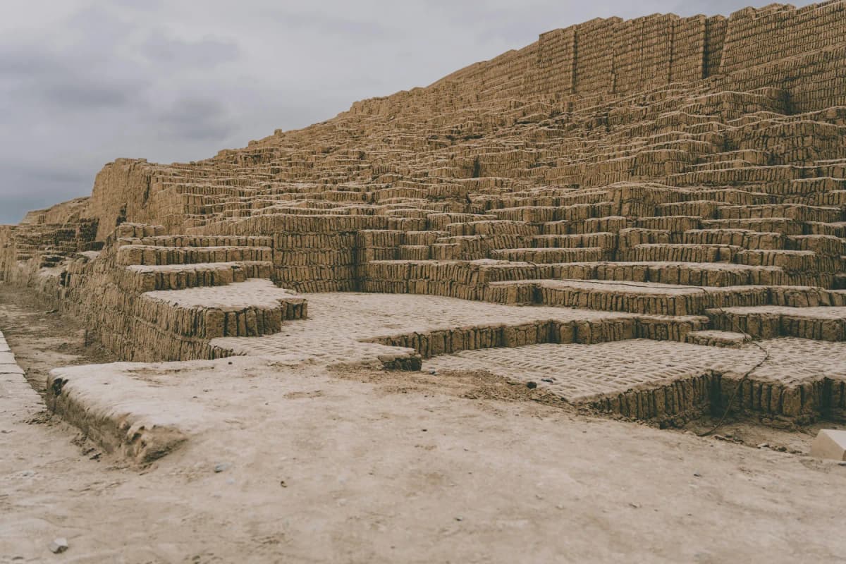 The stepped adobe brick walls of Huaca Pucllana, an ancient pyramid in Miraflores, Lima