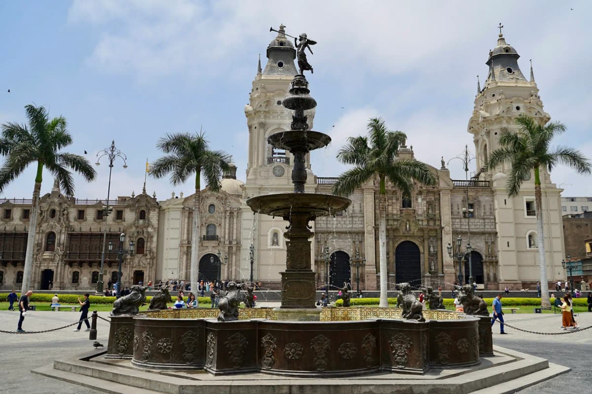 The bronze fountain and the cathedral on the Plaza Mayor in Lima's historic centre