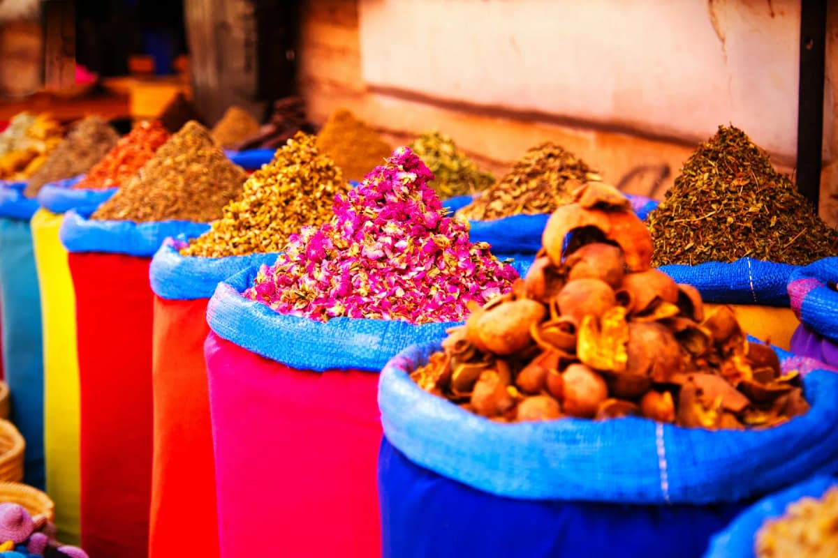 Sacks of colourful ground spices in a Marrakech market