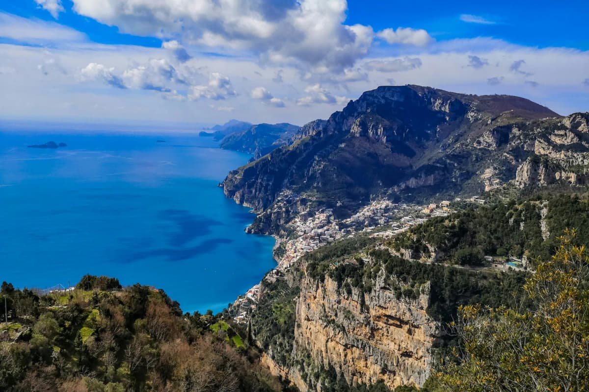 The Positano coastline and the sea seen from high on the mountainside above the town
