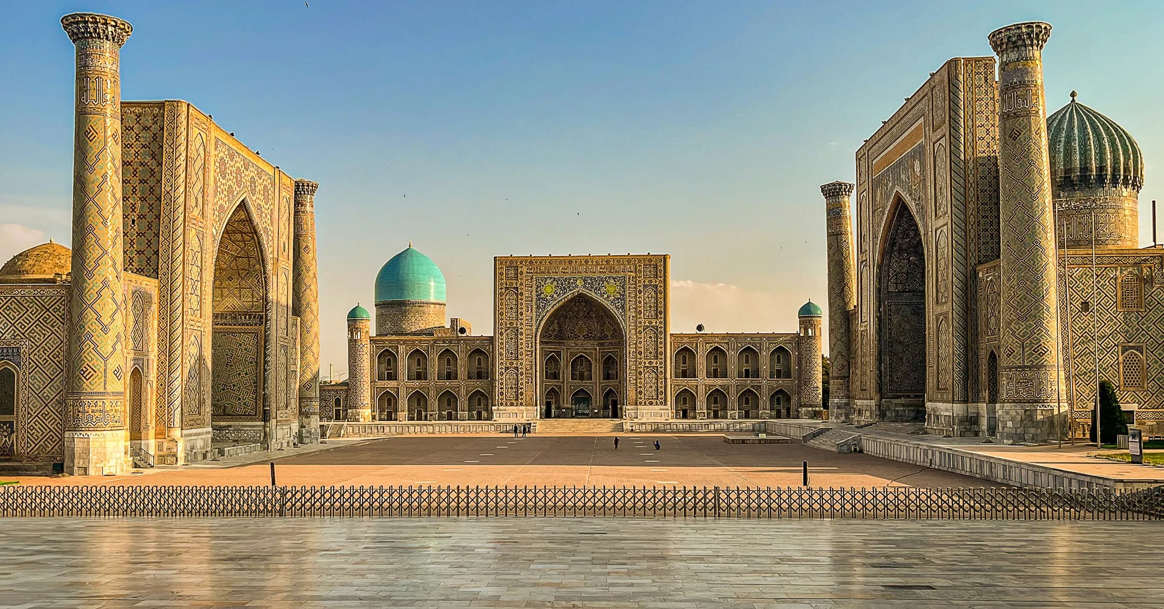 Things to do in Samarkand: the three tiled madrasahs of Registan Square in afternoon light