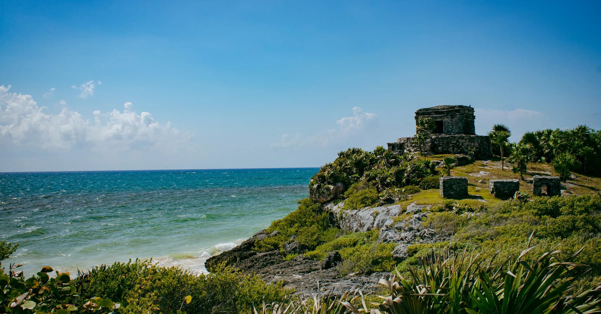 Things to do in Tulum: the Maya ruins on a clifftop above the turquoise Caribbean Sea