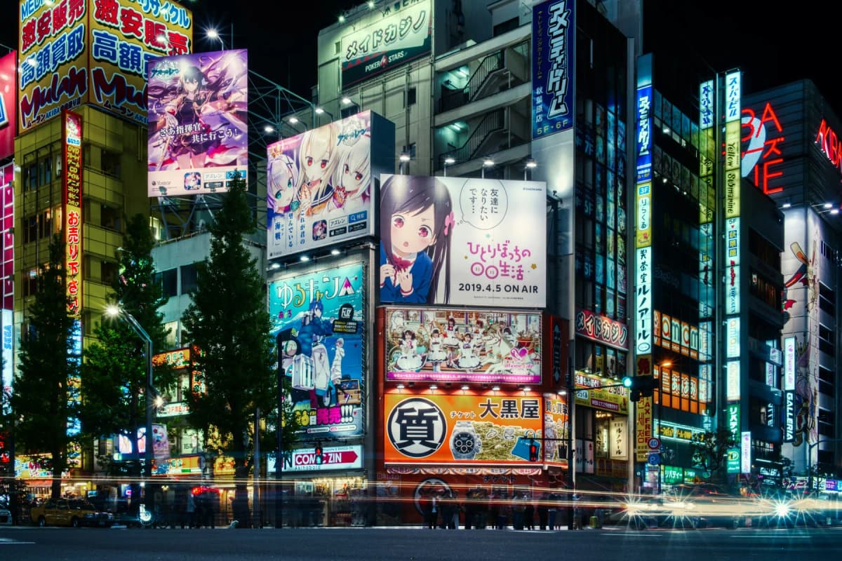 Buildings covered in illuminated anime billboards in Akihabara, Tokyo, at night