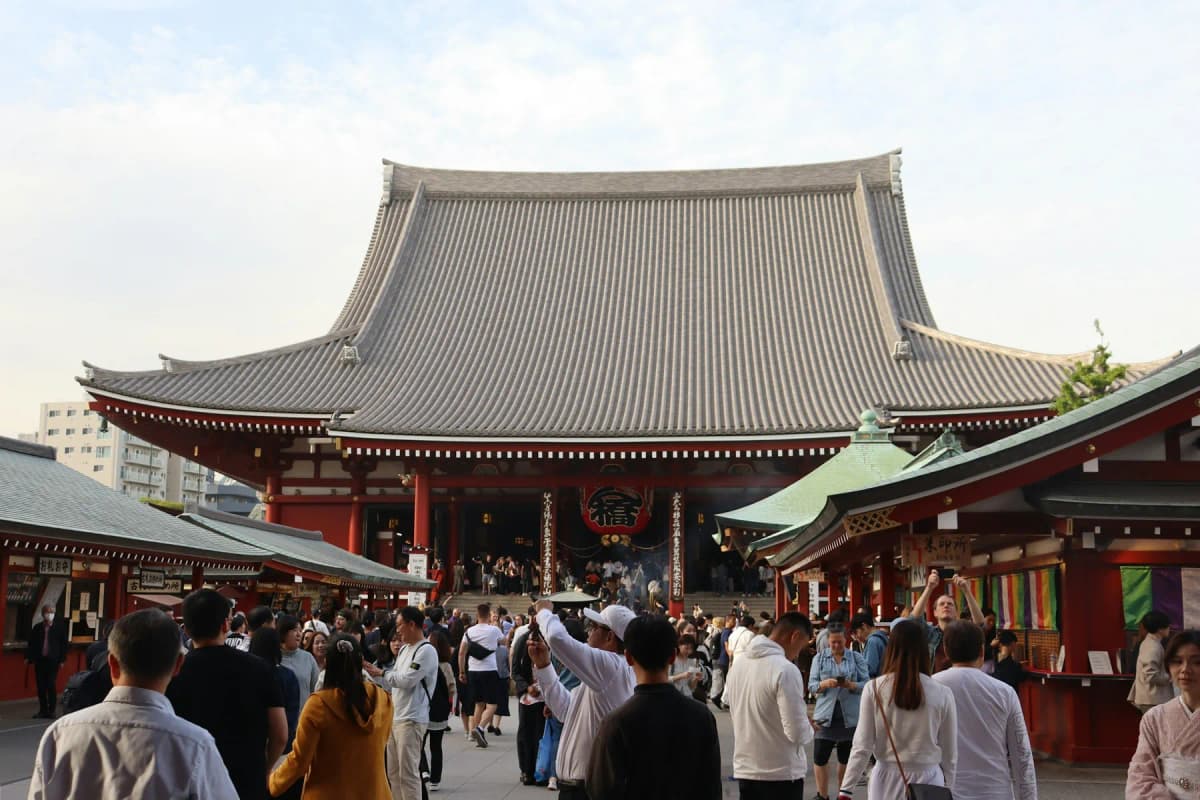 Visitors in front of the main hall of Senso-ji temple in Asakusa, the first stop on this Tokyo itinerary