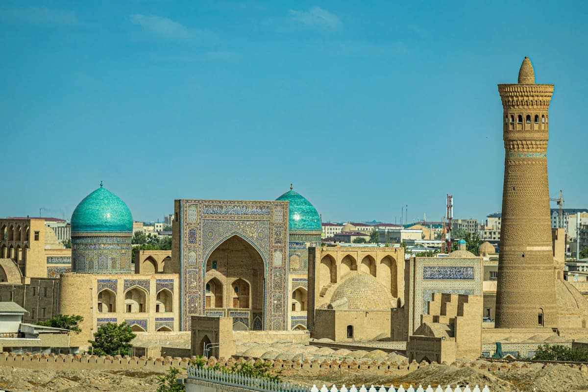 Uzbekistan itinerary: the Kalyan Minaret and turquoise domes of the Po-i-Kalan complex rising over Bukhara's old town