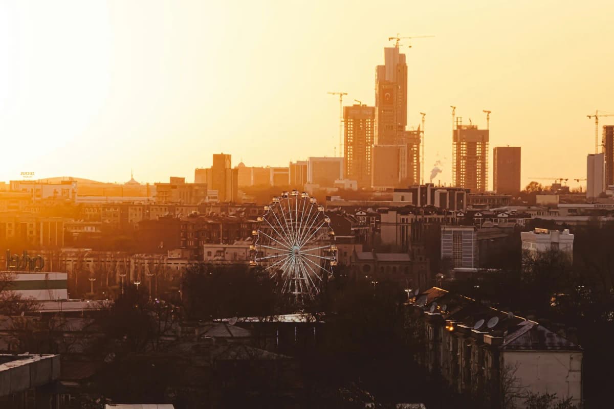 Uzbekistan itinerary: the Tashkent skyline at sunset, with new towers and a Ferris wheel