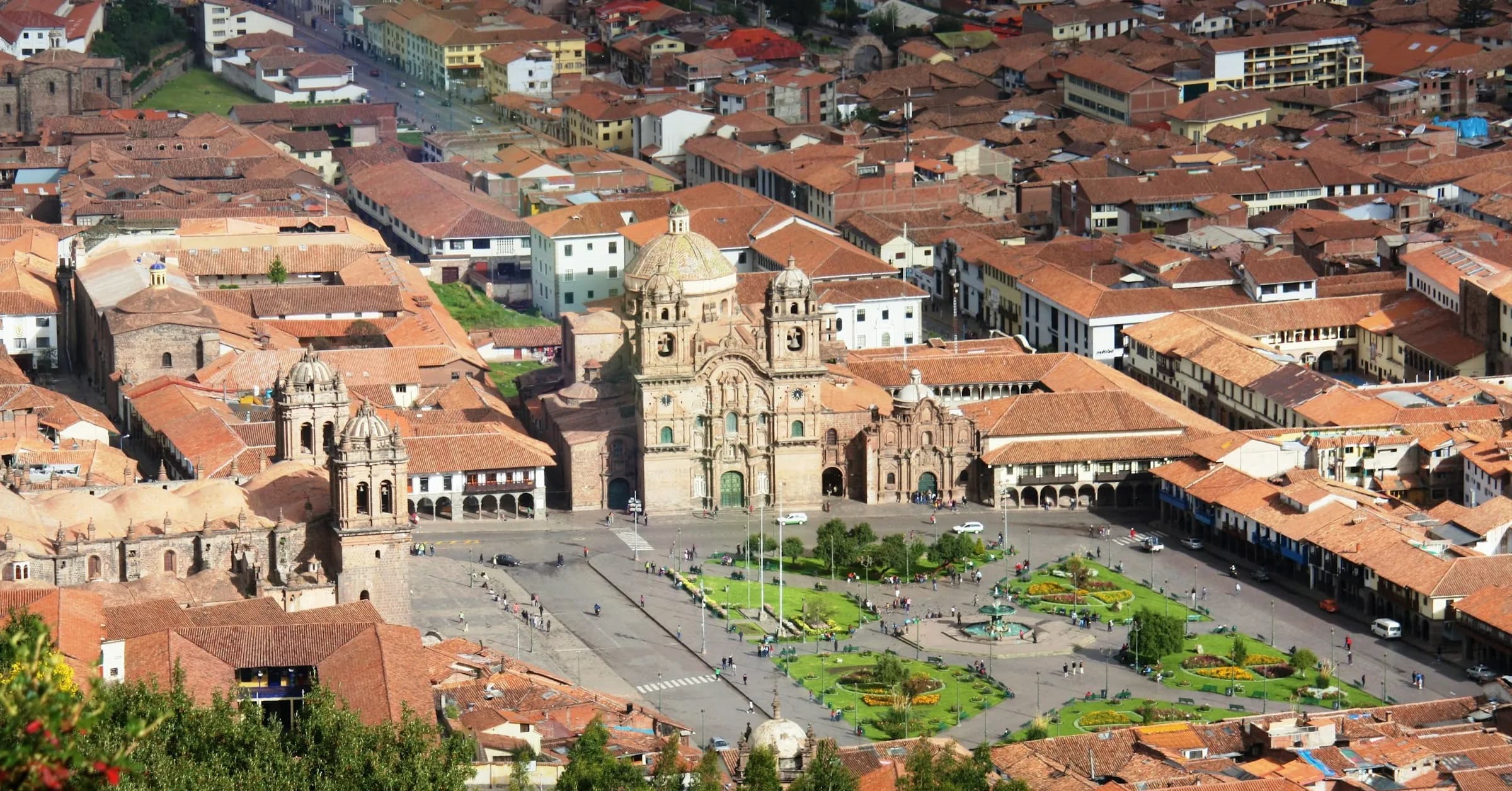 Where to stay in Cusco: the Plaza de Armas and the red-tiled roofs of the historic centre seen from above
