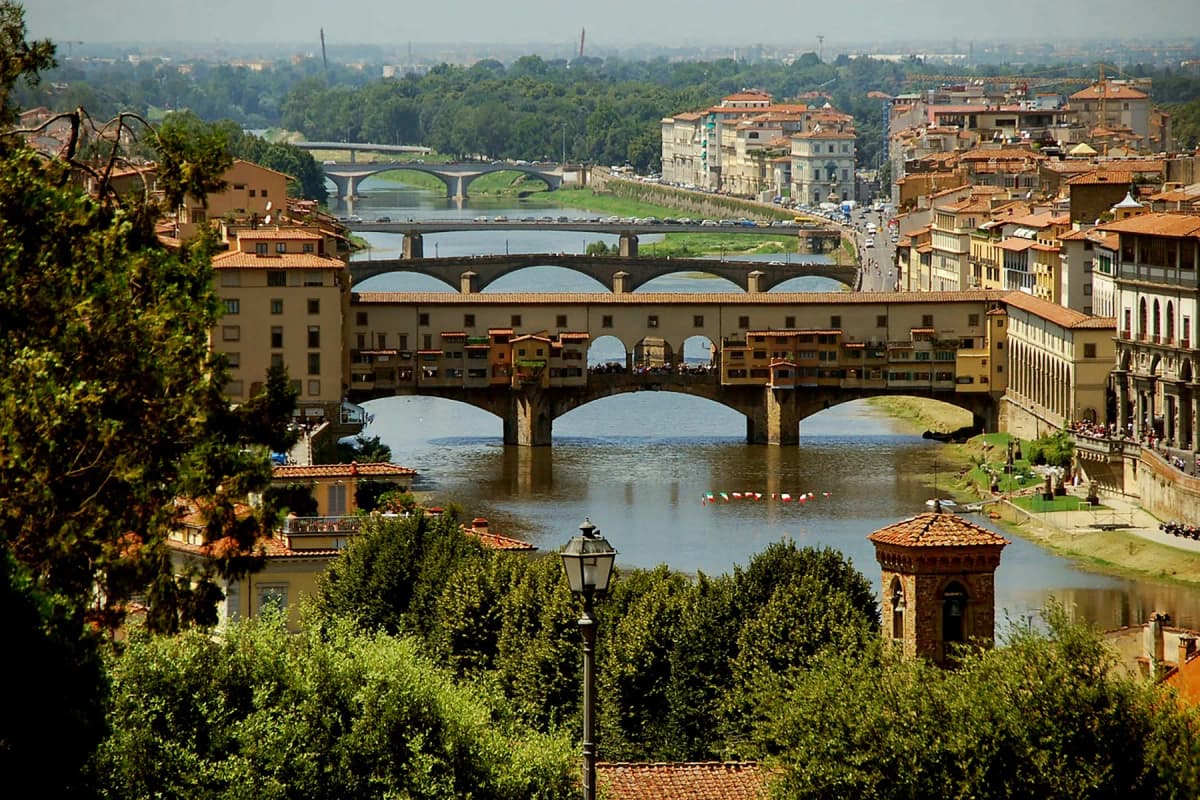 The Ponte Vecchio and the River Arno seen from above with the hills beyond Florence