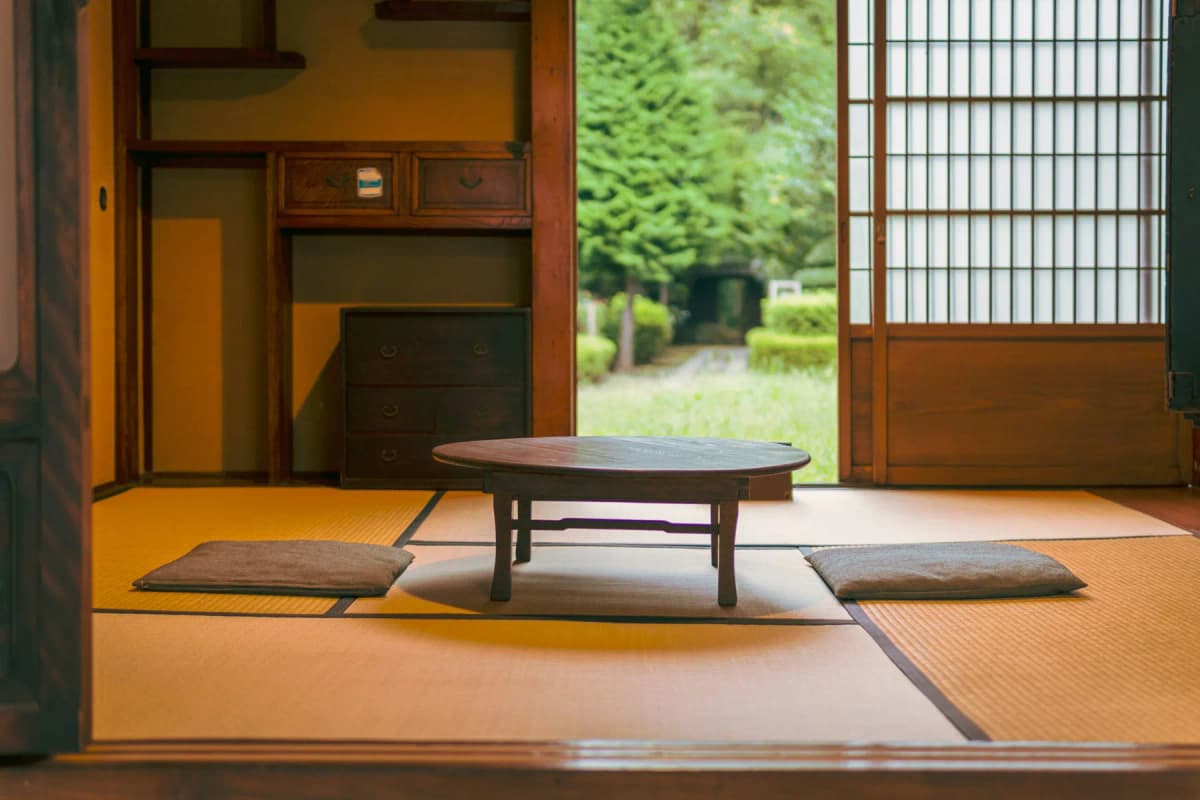 A tatami room with a low table in a traditional Japanese inn