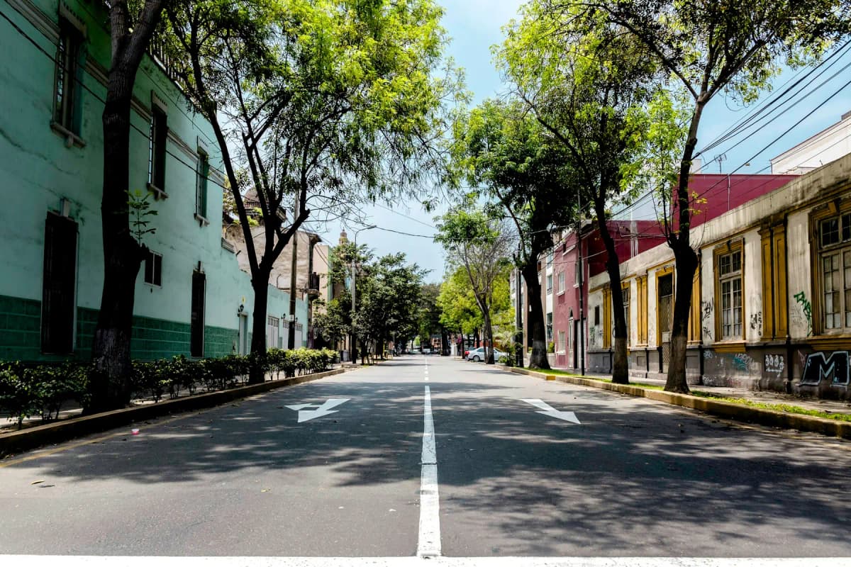 A quiet tree-lined street of old houses in Barranco, Lima