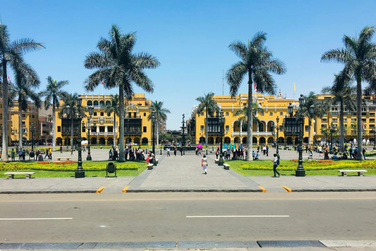 Palm trees and the yellow colonial buildings around Lima's Plaza de Armas