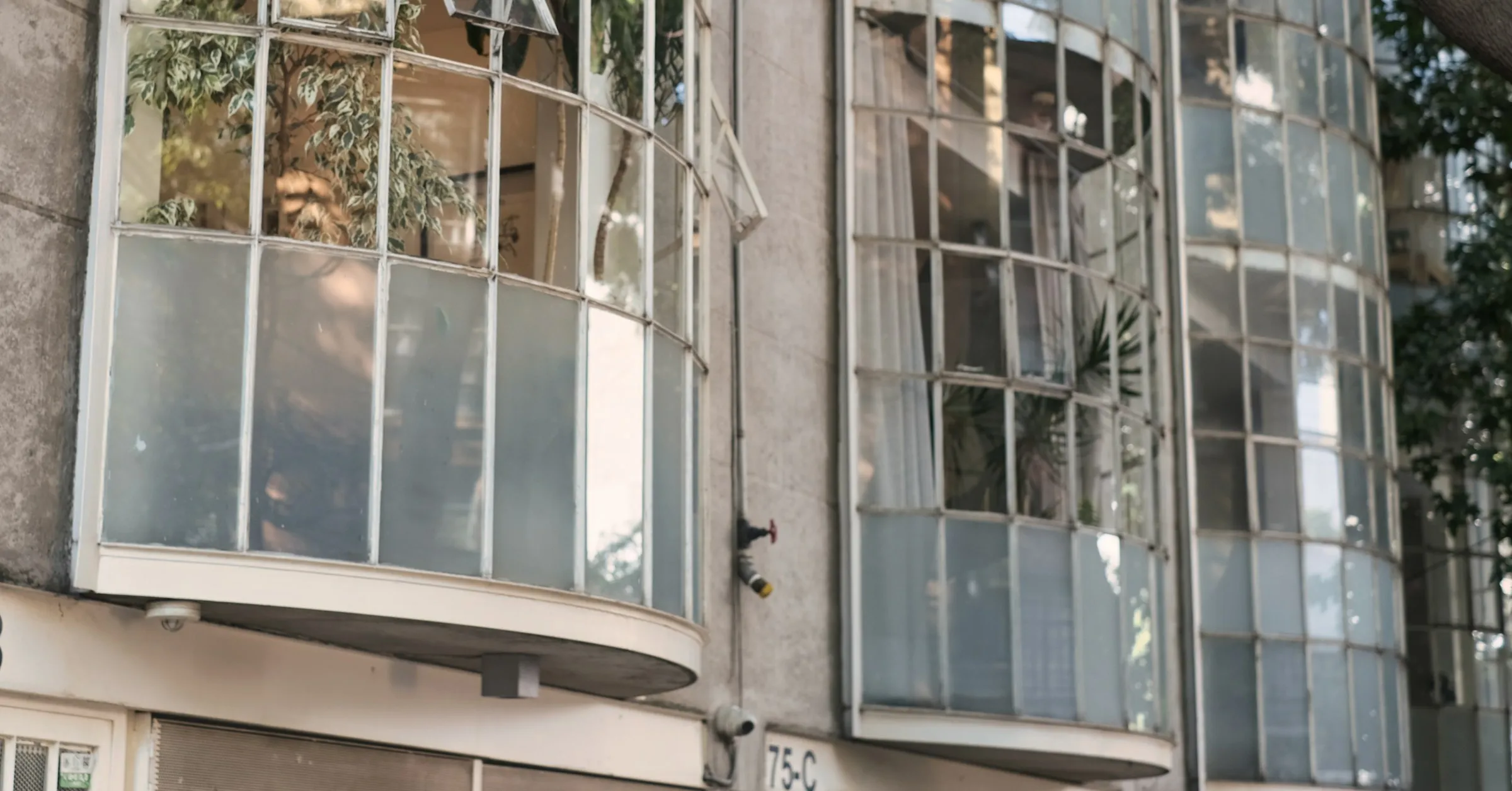 Where to stay in Mexico City: an Art Deco apartment building with curved glass bay windows in Condesa