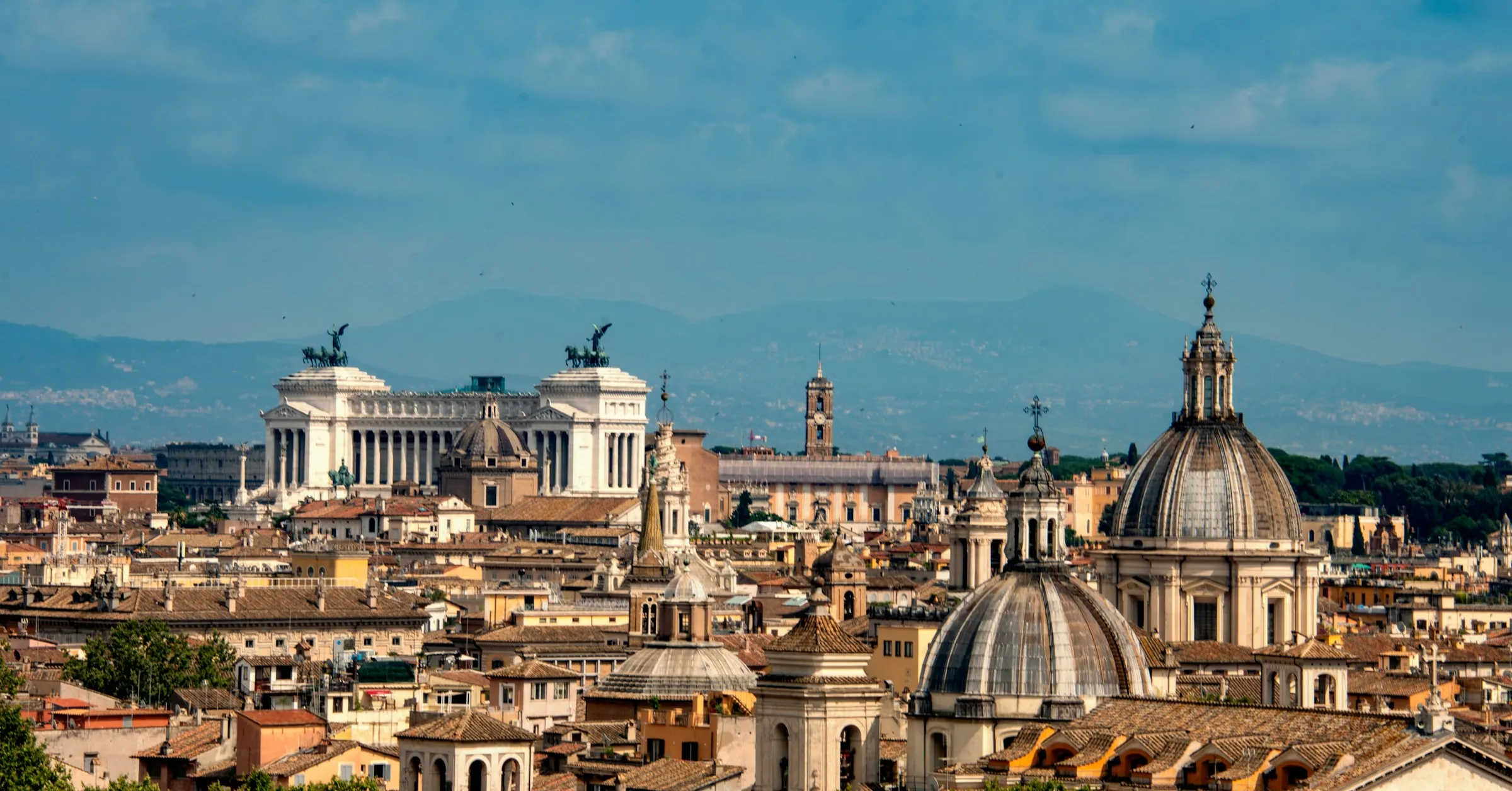 Where to stay in Rome: the rooftops and domes of the historic centre seen from above
