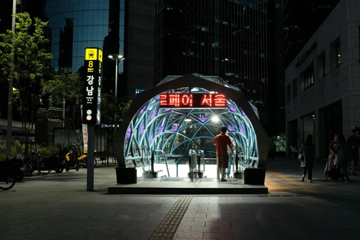 The entrance to Gangnam subway station lit up at night