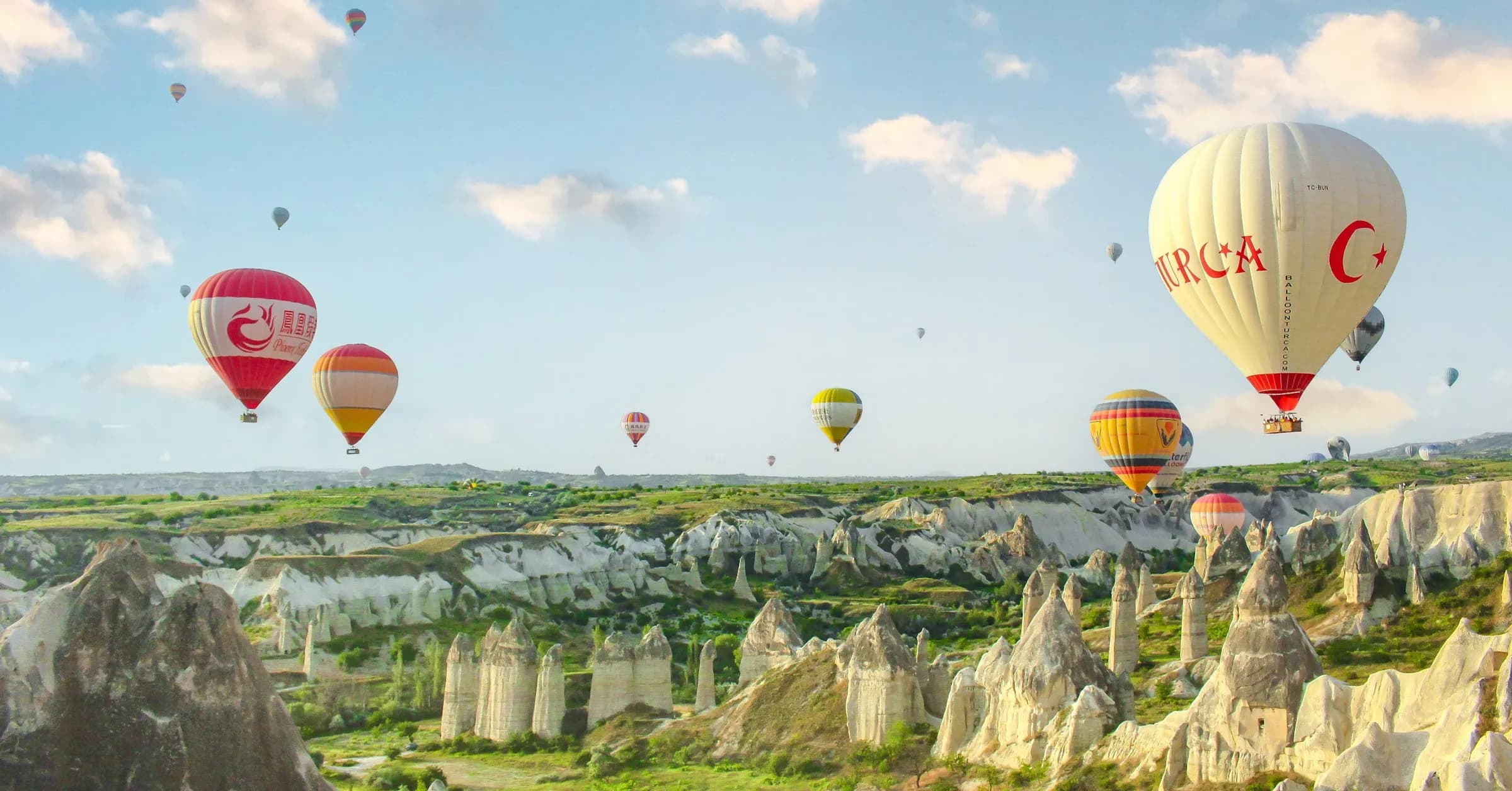 Best time to visit Turkey: hot air balloons rising over the valleys of Cappadocia at sunrise