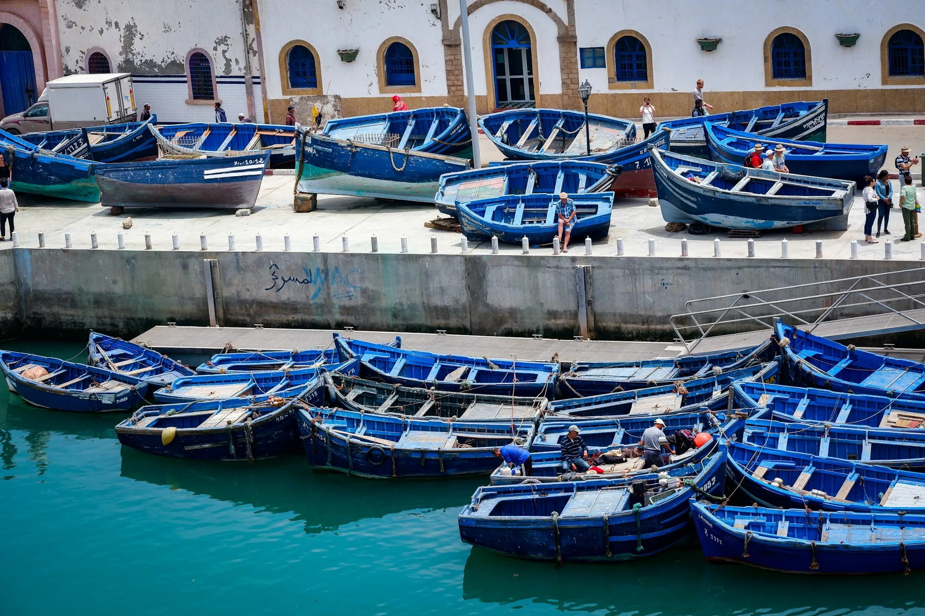 Blue wooden fishing boats in the harbour at Essaouira