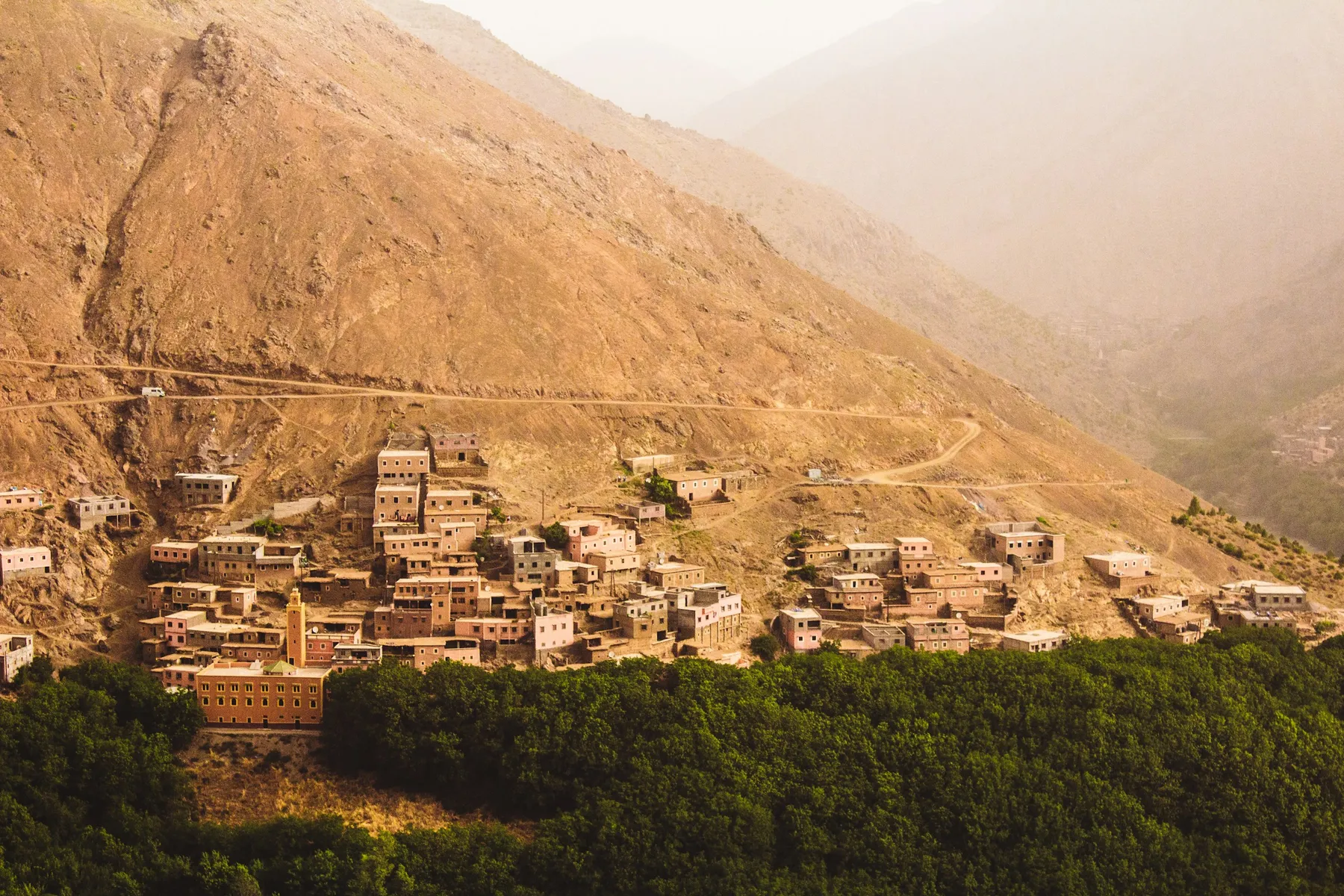 Terraced stone houses of Imlil village among walnut trees in the High Atlas mountains