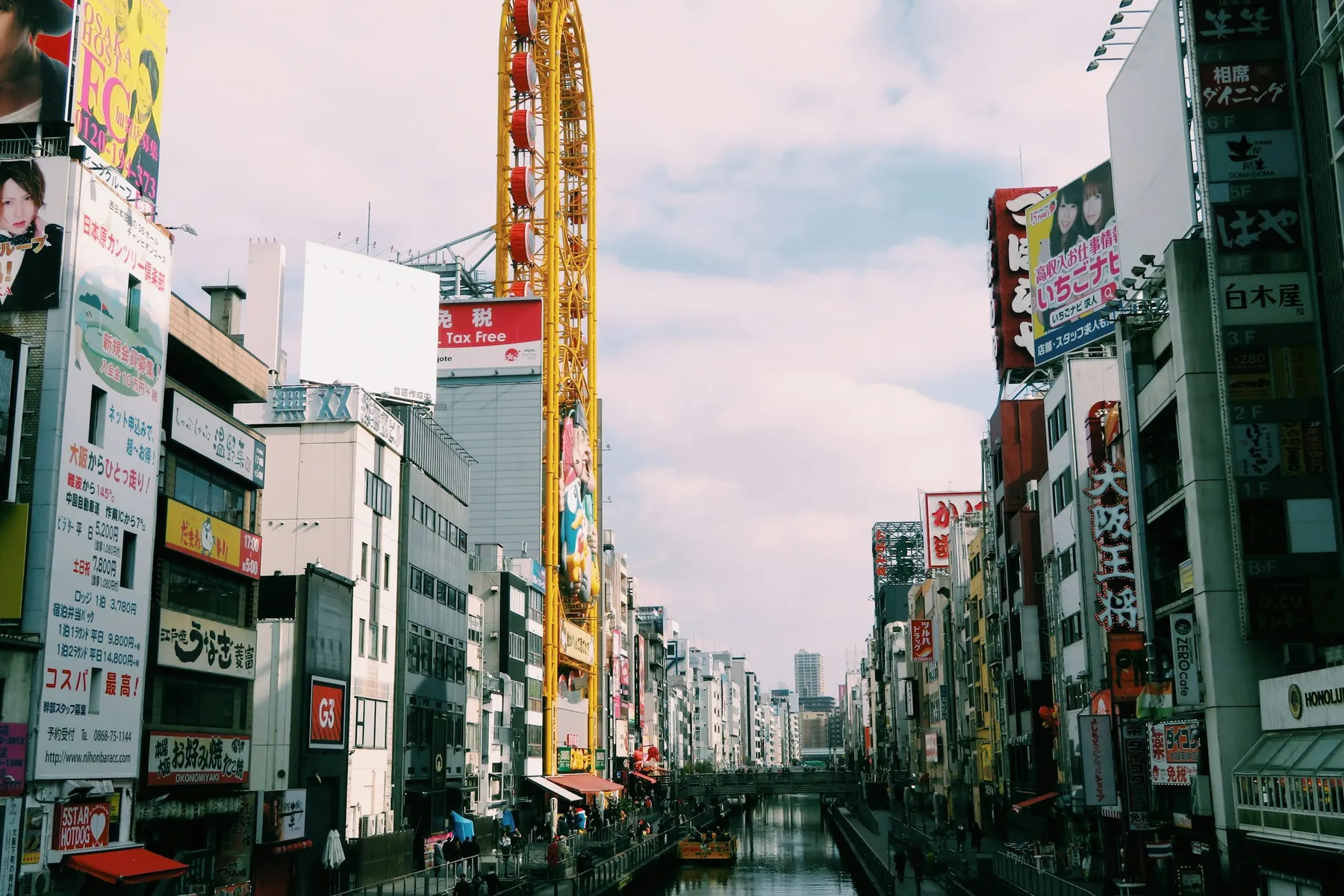 The Dotonbori canal in Osaka, lined with signs and neon billboards