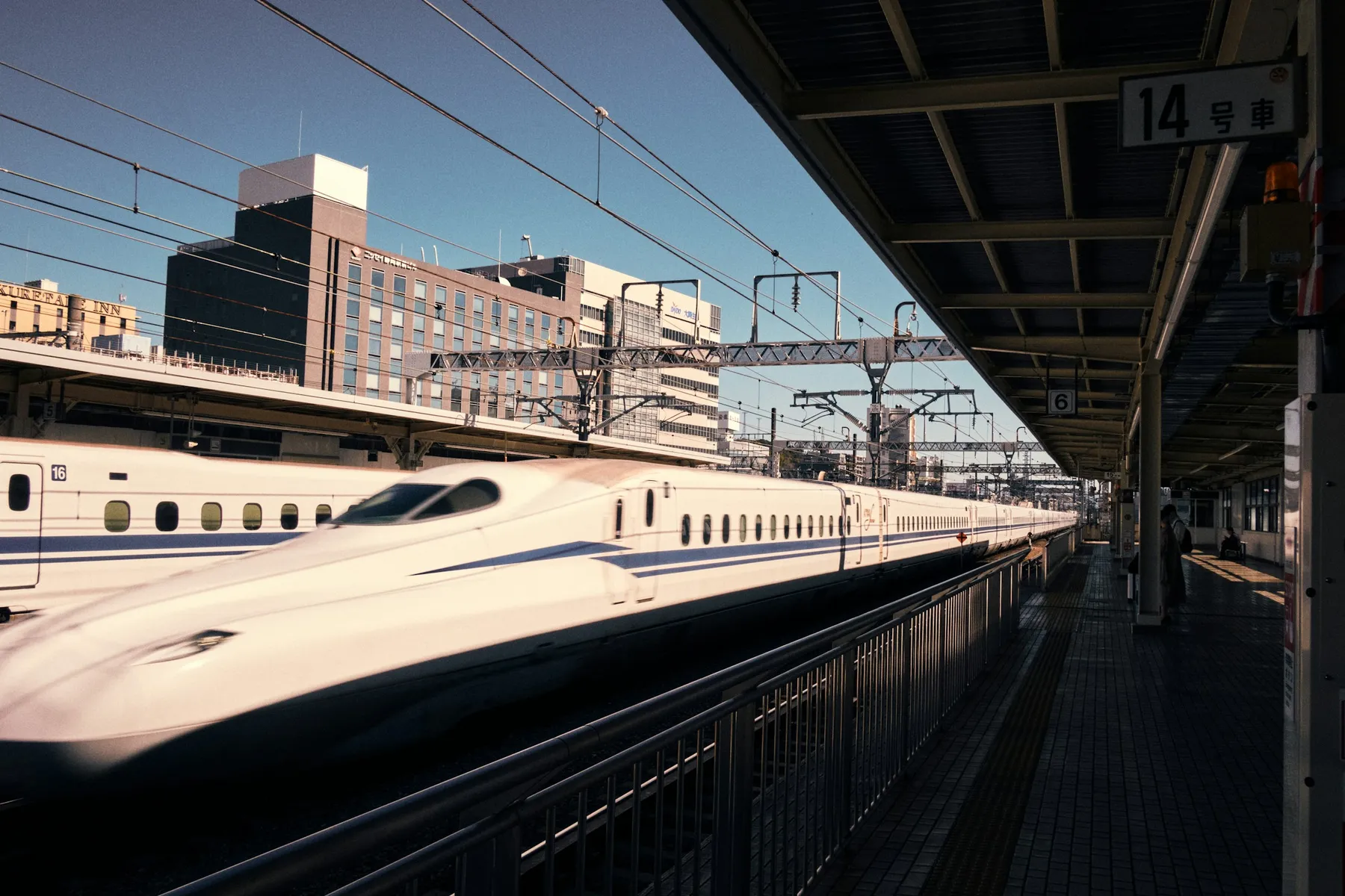 A Shinkansen bullet train at a platform in Kyoto Station