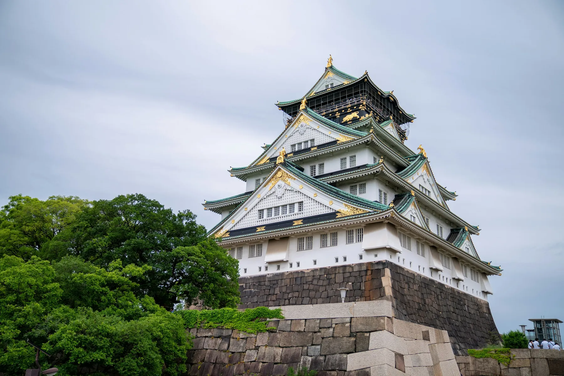 Osaka Castle's main keep above its stone walls