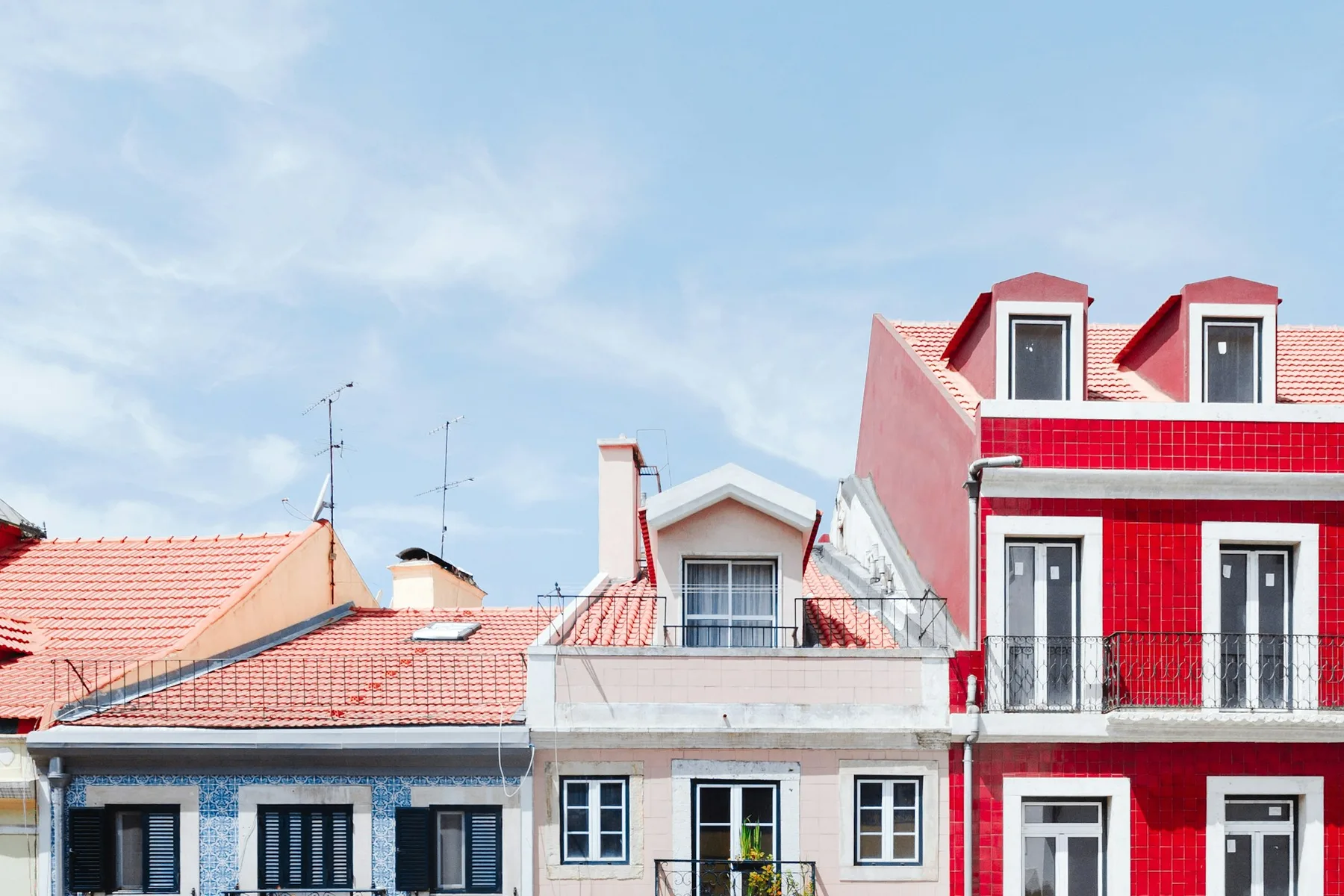 Colourful houses lining a hillside street near Jardim do Torel in Lisbon