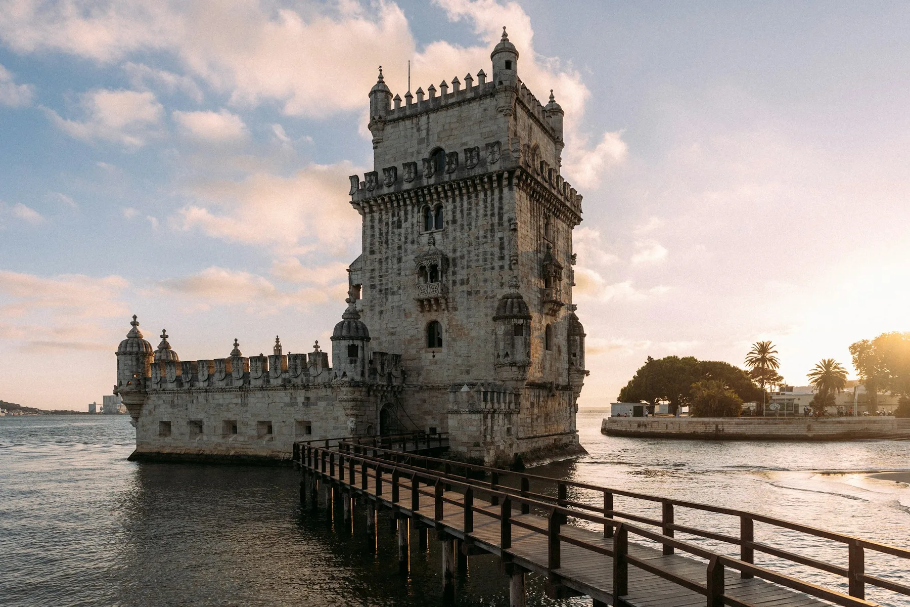 The Torre de Belém standing at the edge of the Tagus river in Lisbon
